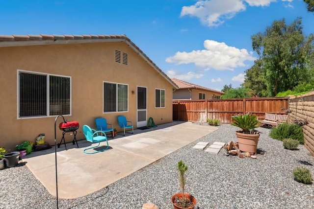 7704 Couples Way, Hemet, CA 92545 - back of house featuring a fenced backyard, a patio area, and stucco siding