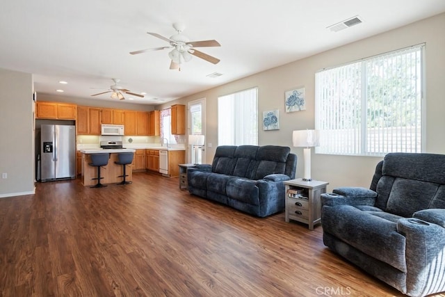 7704 Couples Way, Hemet, CA 92545 - living room featuring dark wood-type flooring, a ceiling fan, and recessed lighting