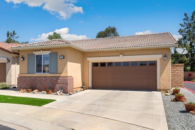 7704 Couples Way, Hemet, CA 92545 - view of front of house featuring a tiled roof, a garage, and concrete driveway