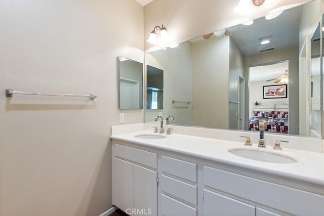 7704 Couples Way, Hemet, CA 92545 - bathroom with double vanity and a ceiling fan