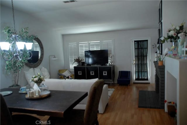 2007 Aberdeen Dr, Corona, CA 92881 - dining area featuring a chandelier and wood finished floors