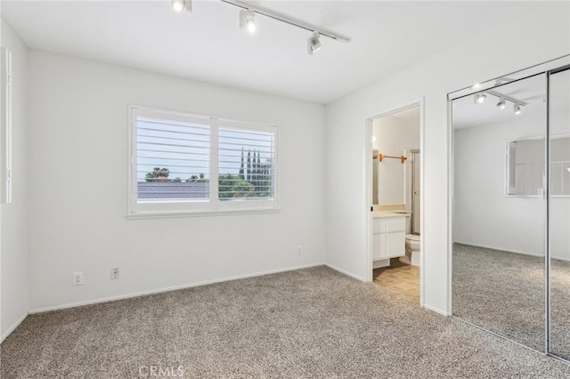 740 Great Bend Dr, Diamond Bar, CA 91765 - unfurnished bedroom featuring track lighting, light carpet, a closet, and connected bathroom