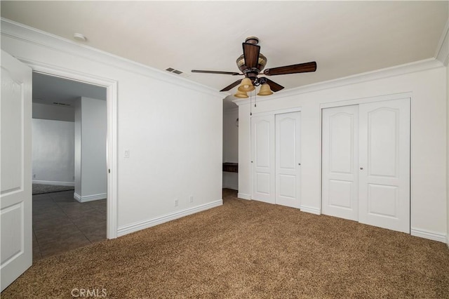 30221 Lands End Pl, Canyon Lake, CA 92587 - unfurnished bedroom featuring multiple closets, ornamental molding, carpet flooring, and ceiling fan