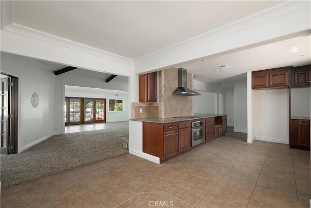 30221 Lands End Pl, Canyon Lake, CA 92587 - kitchen with wall chimney range hood, oven, backsplash, light tile patterned flooring, and open floor plan