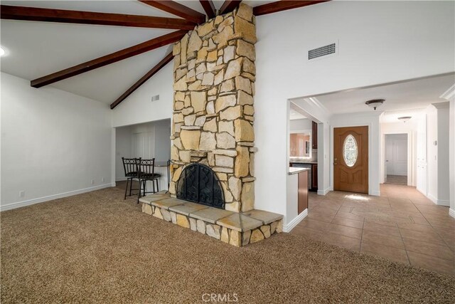 30221 Lands End Pl, Canyon Lake, CA 92587 - unfurnished living room with high vaulted ceiling, beam ceiling, carpet flooring, a stone fireplace, and tile patterned floors