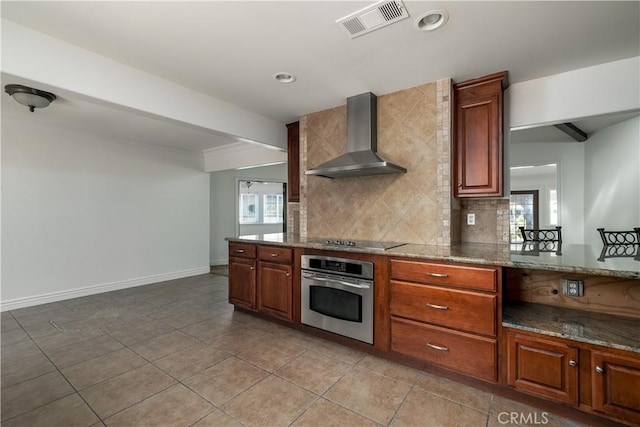 30221 Lands End Pl, Canyon Lake, CA 92587 - kitchen with wall chimney range hood, oven, black electric stovetop, decorative backsplash, and stone countertops