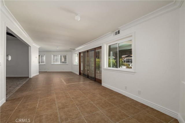 30221 Lands End Pl, Canyon Lake, CA 92587 - empty room featuring crown molding and dark tile patterned floors