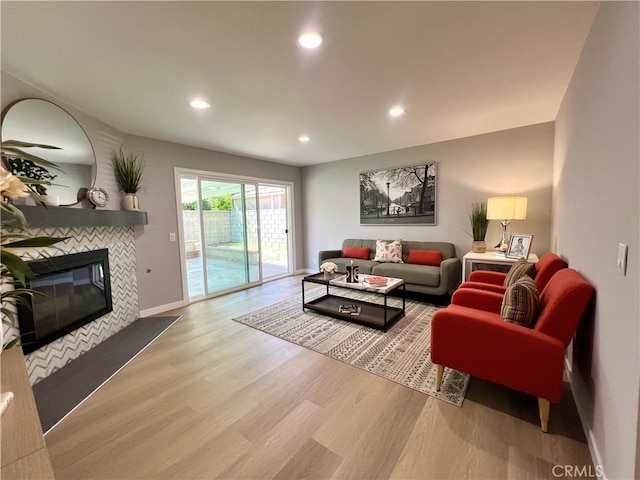 1626 S Pacific Ave, Santa Ana, CA 92704 - living area featuring wood finished floors, recessed lighting, and a tiled fireplace