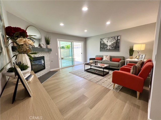 1626 S Pacific Ave, Santa Ana, CA 92704 - living area featuring light wood-style floors, a fireplace, and recessed lighting