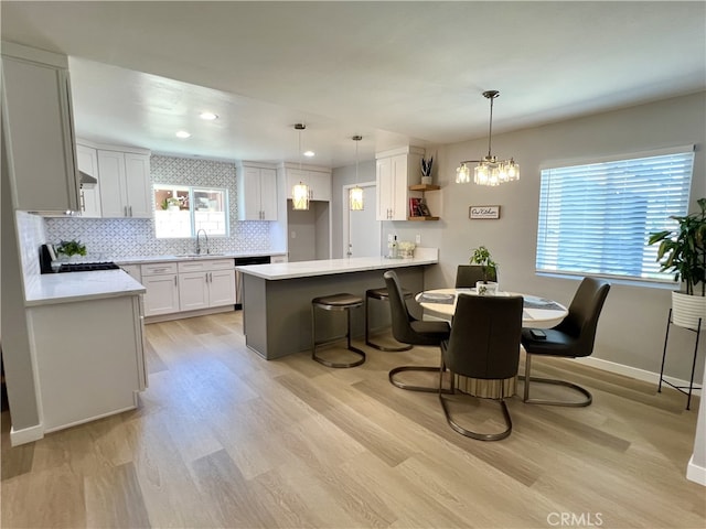 1626 S Pacific Ave, Santa Ana, CA 92704 - dining area featuring light wood-type flooring, a chandelier, and recessed lighting