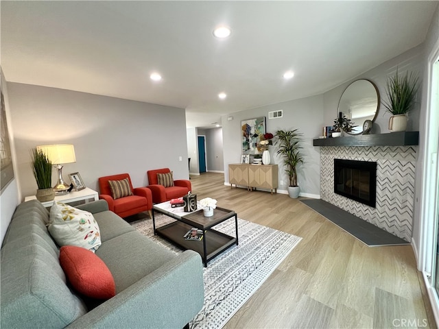 1626 S Pacific Ave, Santa Ana, CA 92704 - living area with light wood finished floors, a fireplace, and recessed lighting