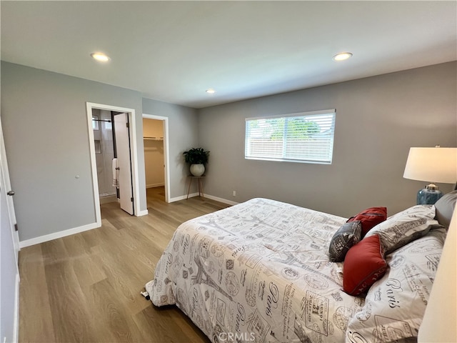 1626 S Pacific Ave, Santa Ana, CA 92704 - bedroom featuring wood finished floors, recessed lighting, and a spacious closet