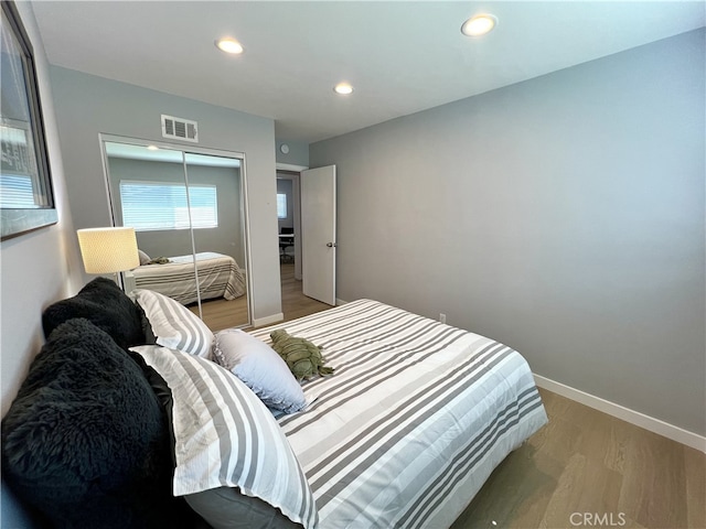 1626 S Pacific Ave, Santa Ana, CA 92704 - bedroom with light wood finished floors, recessed lighting, and a closet