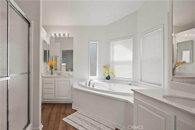 20197 Canyon View Dr, Canyon Country, CA 91351 - full bath featuring a shower stall, two vanities, a garden tub, and wood finished floors
