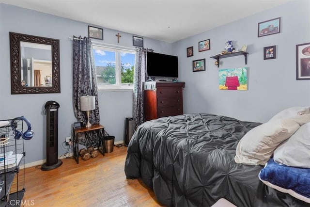 10143 Fremont Ave, Montclair, CA 91763 - bedroom featuring wood finished floors and baseboards