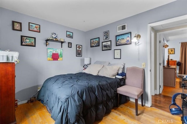 10143 Fremont Ave, Montclair, CA 91763 - bedroom featuring wood finished floors