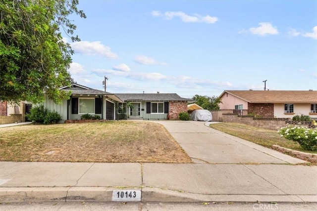 10143 Fremont Ave, Montclair, CA 91763 - single story home with driveway, an attached garage, and brick siding