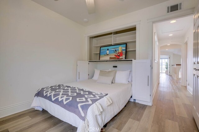 23851 Catamaran Way Unit 1, Laguna Niguel, CA 92677 - bedroom with wood finished floors, a ceiling fan, recessed lighting, and a closet
