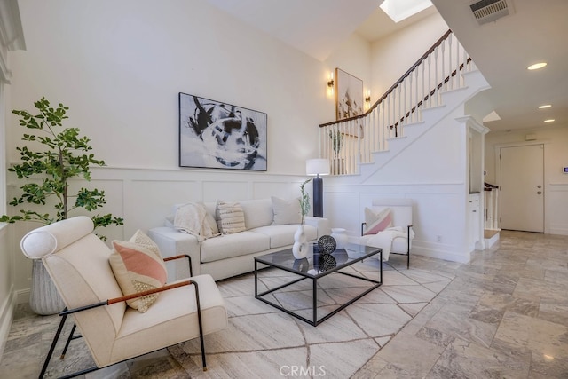 23851 Catamaran Way Unit 1, Laguna Niguel, CA 92677 - living area with a decorative wall, stairs, recessed lighting, and wainscoting