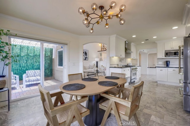 23851 Catamaran Way Unit 1, Laguna Niguel, CA 92677 - dining space with a chandelier, arched walkways, ornamental molding, light marble finish flooring, and recessed lighting