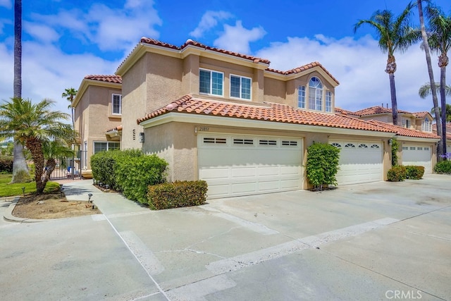 23851 Catamaran Way Unit 1, Laguna Niguel, CA 92677 - mediterranean / spanish-style home featuring concrete driveway, stucco siding, a tiled roof, and an attached garage