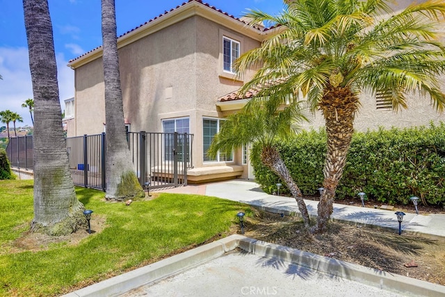23851 Catamaran Way Unit 1, Laguna Niguel, CA 92677 - view of front of house featuring stucco siding and a tile roof