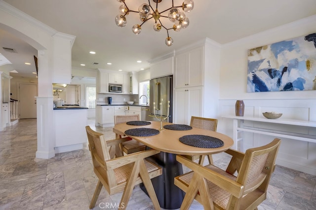 23851 Catamaran Way Unit 1, Laguna Niguel, CA 92677 - dining area featuring arched walkways, recessed lighting, a chandelier, and ornamental molding