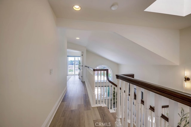 23851 Catamaran Way Unit 1, Laguna Niguel, CA 92677 - corridor with an upstairs landing, wood finished floors, vaulted ceiling, and recessed lighting