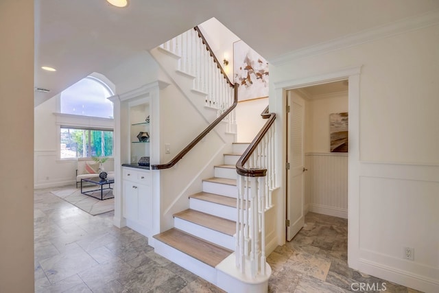 23851 Catamaran Way Unit 1, Laguna Niguel, CA 92677 - stairway with stone finish flooring, a wainscoted wall, ornamental molding, and recessed lighting