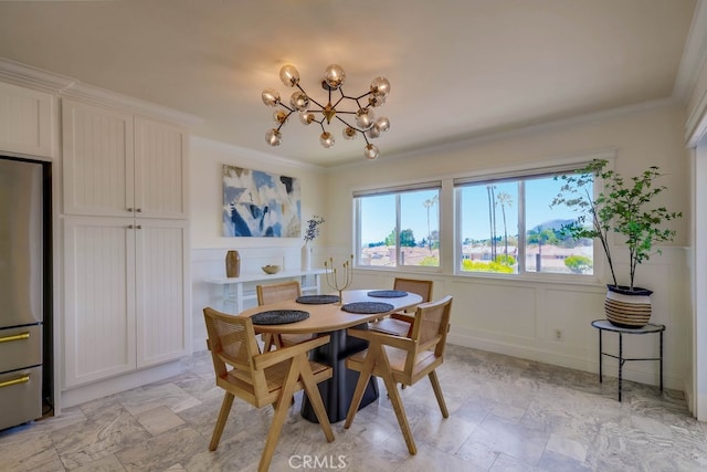 23851 Catamaran Way Unit 1, Laguna Niguel, CA 92677 - dining area with a chandelier, a decorative wall, ornamental molding, and a wainscoted wall