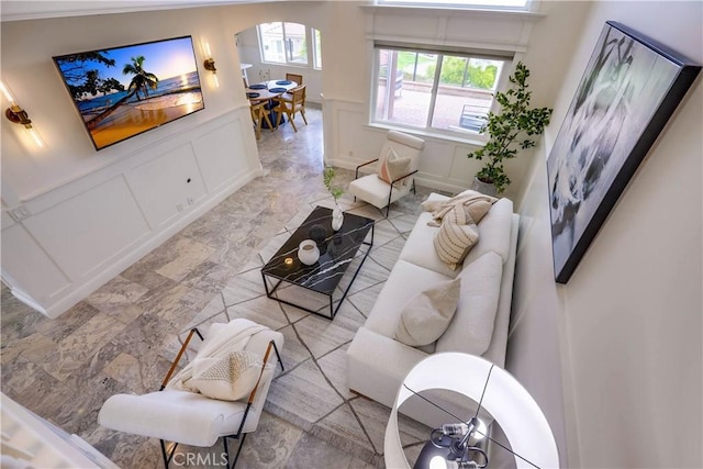 23851 Catamaran Way Unit 1, Laguna Niguel, CA 92677 - living area featuring a decorative wall, arched walkways, and wainscoting