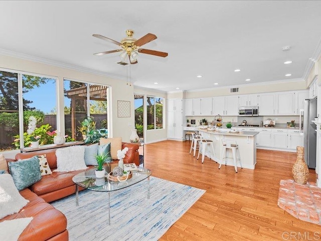 2381 Avenida Helecho, Carlsbad, CA 92009 - living area featuring ornamental molding, light wood-style floors, ceiling fan, and recessed lighting