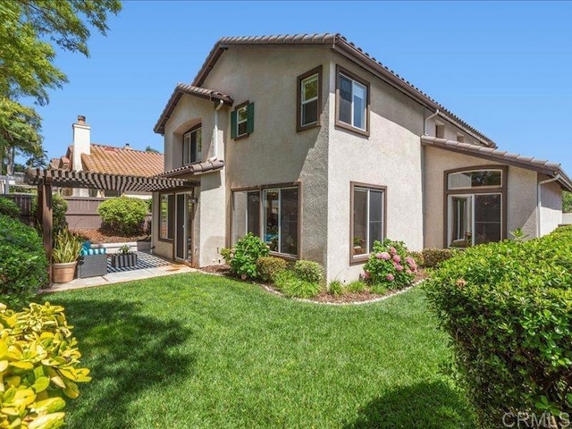 2381 Avenida Helecho, Carlsbad, CA 92009 - back of property featuring stucco siding, a pergola, and a patio
