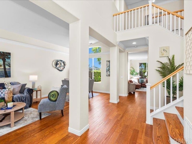 2381 Avenida Helecho, Carlsbad, CA 92009 - foyer entrance with stairs, light wood-style flooring, a towering ceiling, and crown molding