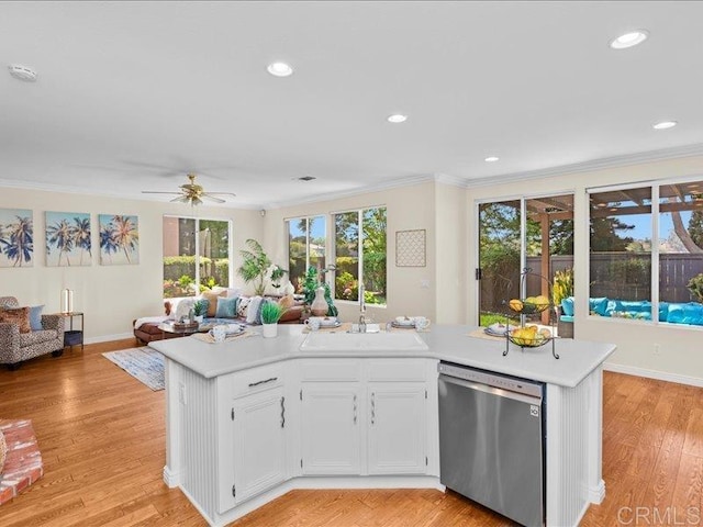 2381 Avenida Helecho, Carlsbad, CA 92009 - kitchen featuring dishwasher, crown molding, open floor plan, light countertops, and white cabinetry