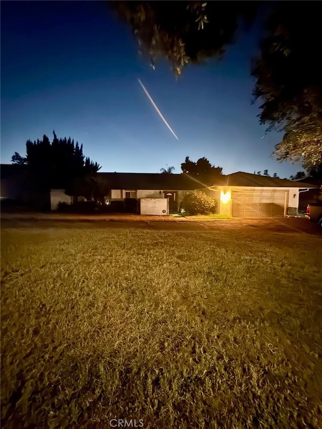 1324 W Fern Ave, Redlands, CA 92373 - view of front facade featuring a garage and stucco siding