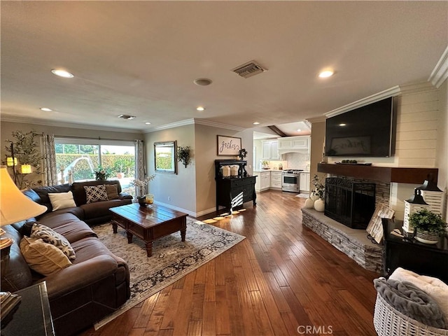 832 Prima Vera Rd, Glendora, CA 91741 - living room featuring crown molding, dark wood-style floors, a stone fireplace, and recessed lighting