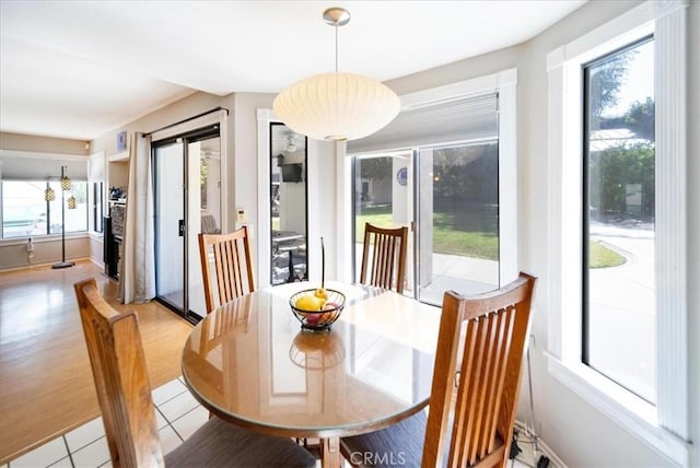 5963 Rio Valle Dr, Bonsall, CA 92003 - dining area with light tile patterned flooring and lofted ceiling