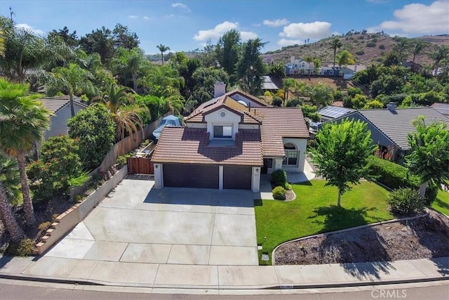 5963 Rio Valle Dr, Bonsall, CA 92003 - view of front of house with a tiled roof, driveway, a mountain view, and a garage