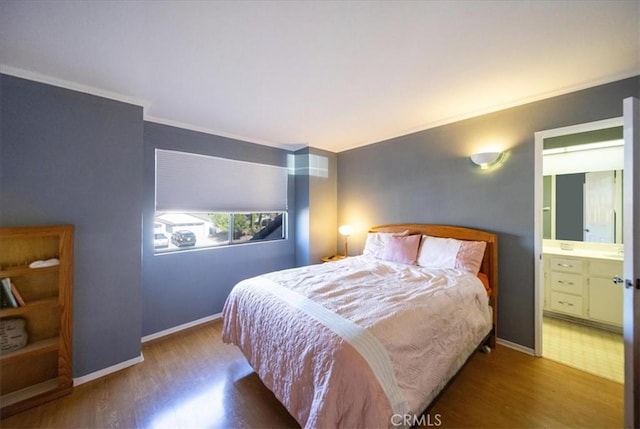 5963 Rio Valle Dr, Bonsall, CA 92003 - bedroom with wood finished floors, ornamental molding, and connected bathroom