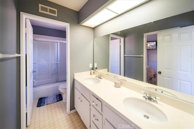 5963 Rio Valle Dr, Bonsall, CA 92003 - bathroom featuring double vanity, bath / shower combo with glass door, and tile patterned floors