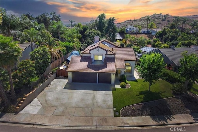 5963 Rio Valle Dr, Bonsall, CA 92003 - view of front of property featuring a tiled roof, driveway, and solar panels