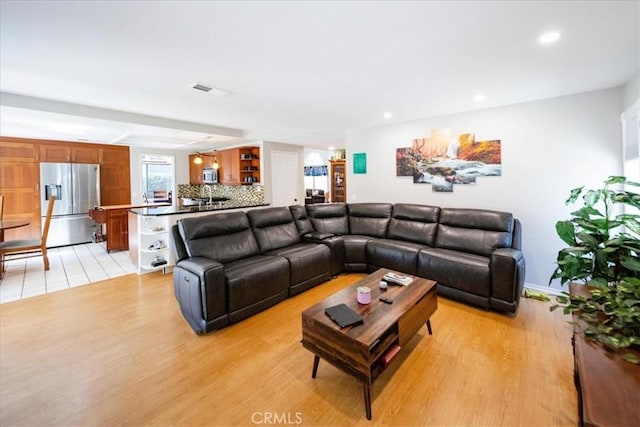 5963 Rio Valle Dr, Bonsall, CA 92003 - living room with light wood-style floors and recessed lighting