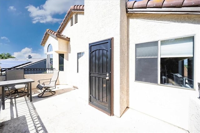5963 Rio Valle Dr, Bonsall, CA 92003 - doorway to property featuring stucco siding and a tiled roof