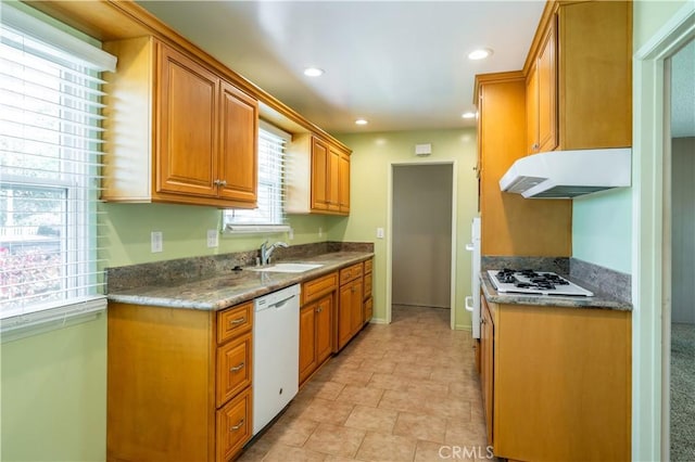 2340 W Saint Anne Pl, Santa Ana, CA 92704 - kitchen with white appliances, range hood, recessed lighting, and brown cabinets