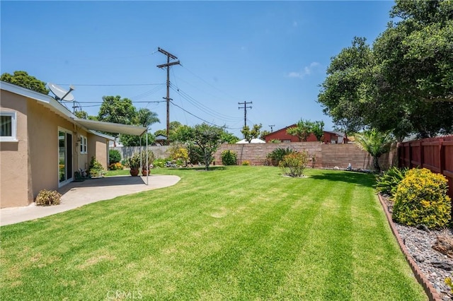 2340 W Saint Anne Pl, Santa Ana, CA 92704 - fenced backyard with a patio