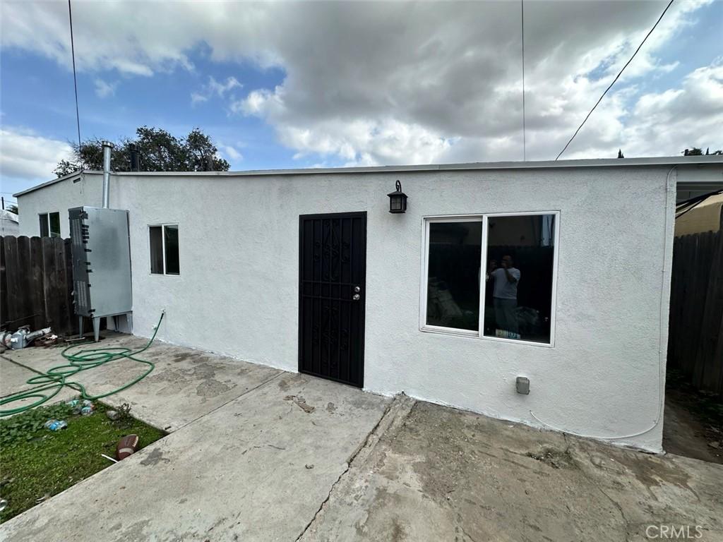 2133 E Lucien St, Compton, CA 90222 - rear view of property with a patio area and stucco siding