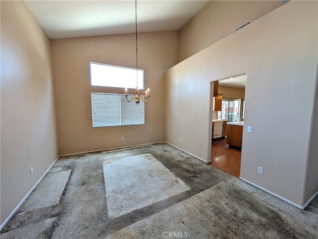 9510 Nickellaus Ct, Corona, CA 92883 - unfurnished dining area with carpet flooring, a chandelier, and high vaulted ceiling