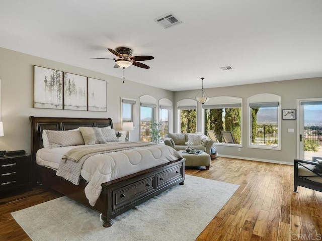 31755 Rancho Vista Rd, Temecula, CA 92592 - bedroom with wood finished floors, access to exterior, and ceiling fan