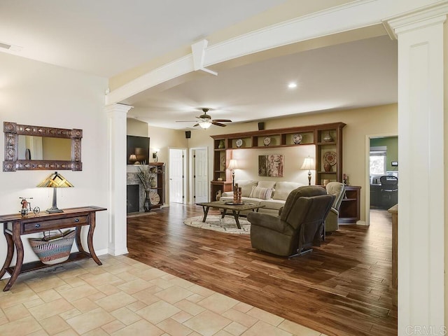 31755 Rancho Vista Rd, Temecula, CA 92592 - living area with decorative columns, ceiling fan, a fireplace, and wood finished floors